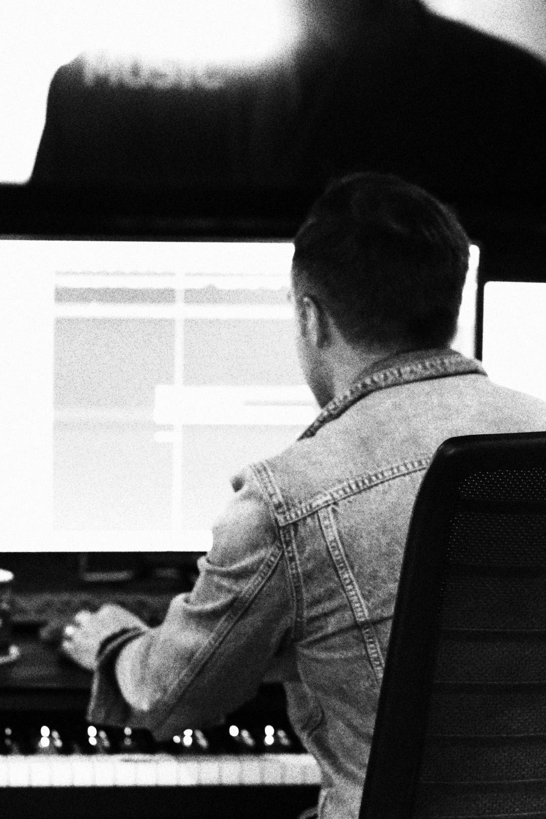 Paul Saunderson working at his studio desk